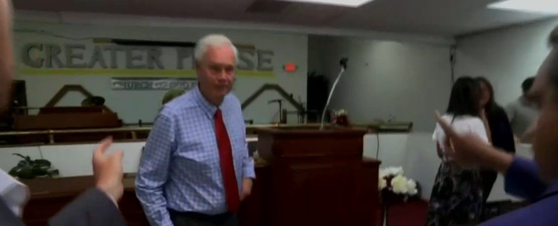 Ron Johnson runs away from reporters at an event in Milwaukee