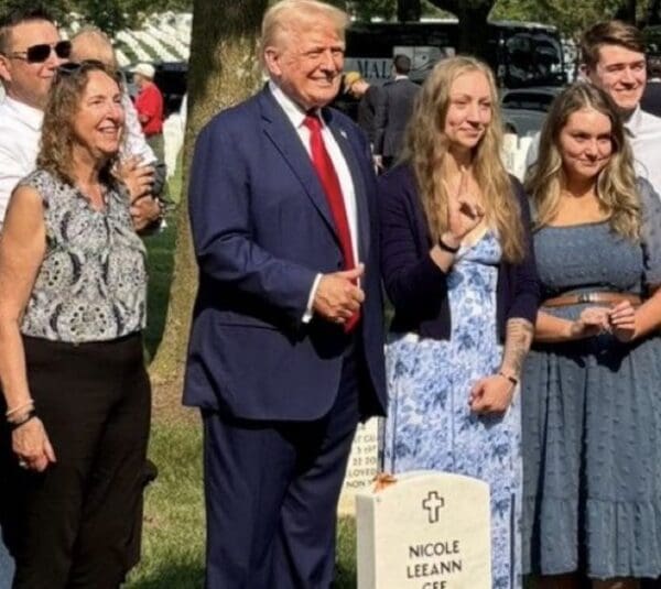 Trump grave thumbs up.