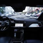 A Waymo autonomous self-driving Jaguar taxi drives along a street on March 14, 2024 in Los Angeles, California.