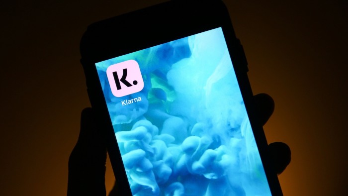 A Klarna app icon on a mobile phone