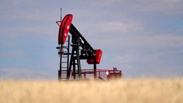 An oil pumpjack in a field