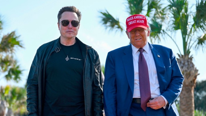 President-elect Donald Trump walks with Elon Musk