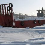 An abandoned coast guard landing craft sits stranded in the snow off the Canadian Arctic settlement of Resolute Bay, Nunavut