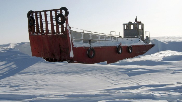 An abandoned coast guard landing craft sits stranded in the snow off the Canadian Arctic settlement of Resolute Bay, Nunavut