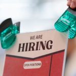 Hiring signage displayed at a job fair hosted in North Carolina