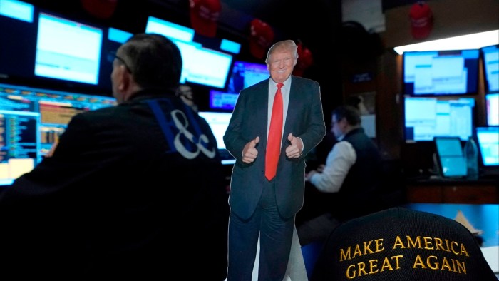 A cardboard cut-out of Donald Trump and a ‘Make America Great Again’ baseball cap