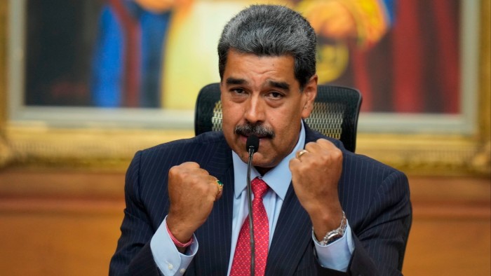 President Nicolas Maduro gestures during a news conference at Miraflores presidential palace in Caracas, Venezuela