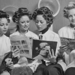 Four women sit in a hair salon in the 1970s