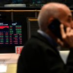 Traders work on the floor of the New York Stock Exchange