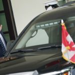 U.S. President Donald Trump waves as Canadian Prime Minister Justin Trudeau’s vehicle leaves following a visit at the White House June 20, 2019