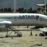 A Latam Airlines aircraft is parked on the tarmac at Arturo Merino Benitez International Airport in Santiago, Chile