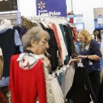 An employee arranges clothing at a Walmart stores in Burbank, California