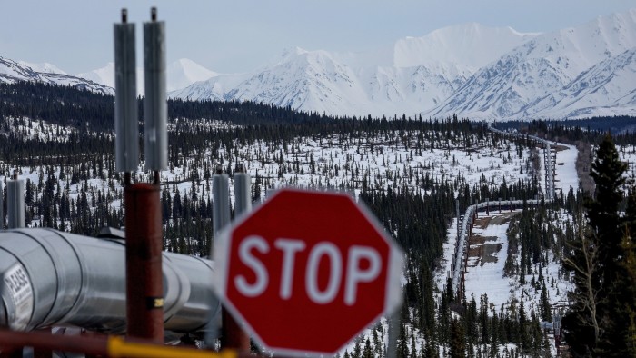 A part of the Trans Alaska Pipeline System runs through boreal forest past Alaska Range mountains near Delta Junction, Alaska